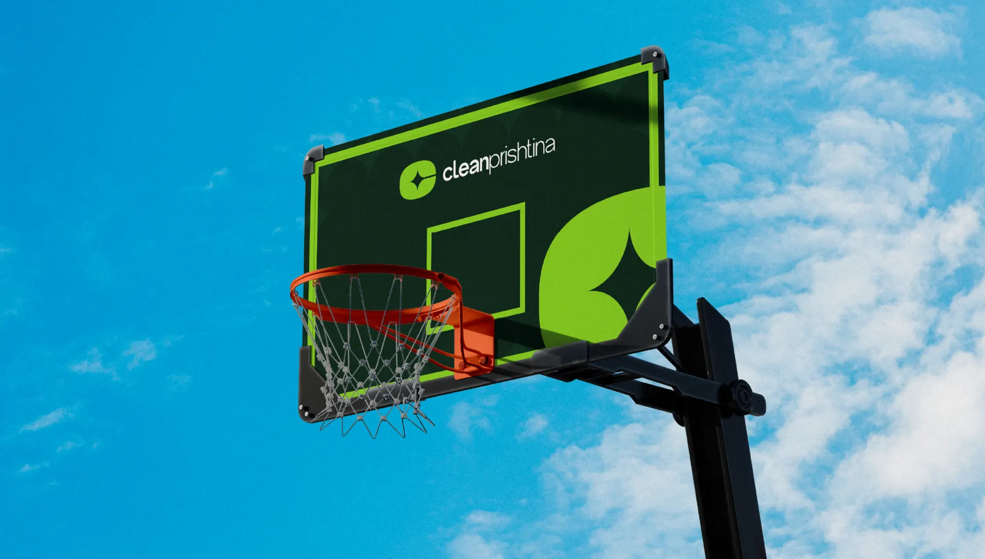 A basketball backboard branded for Clean Prishtina against a blue sky