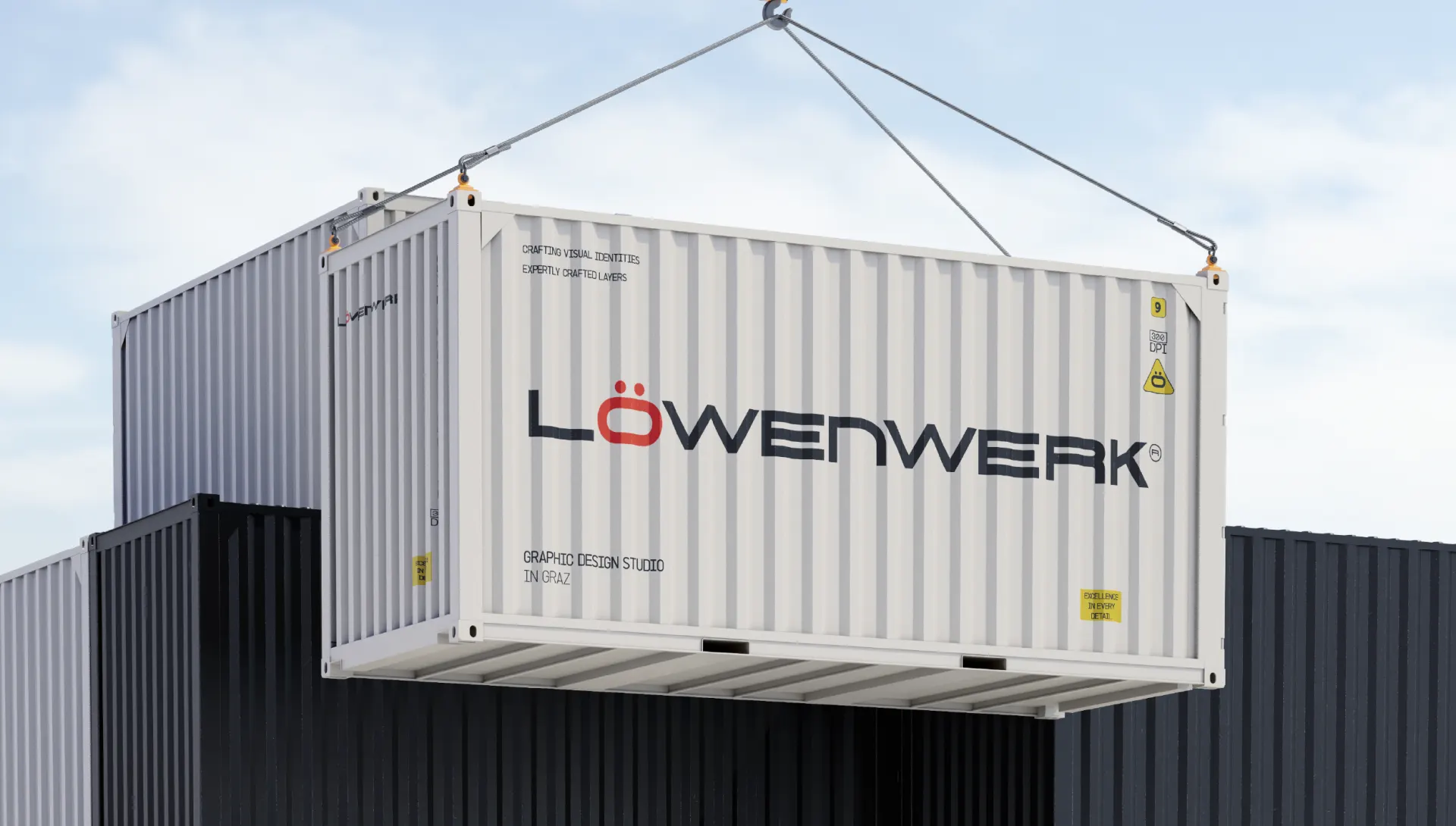 A shipping container painted with the Löwenwerk wordmark, craned against the sky